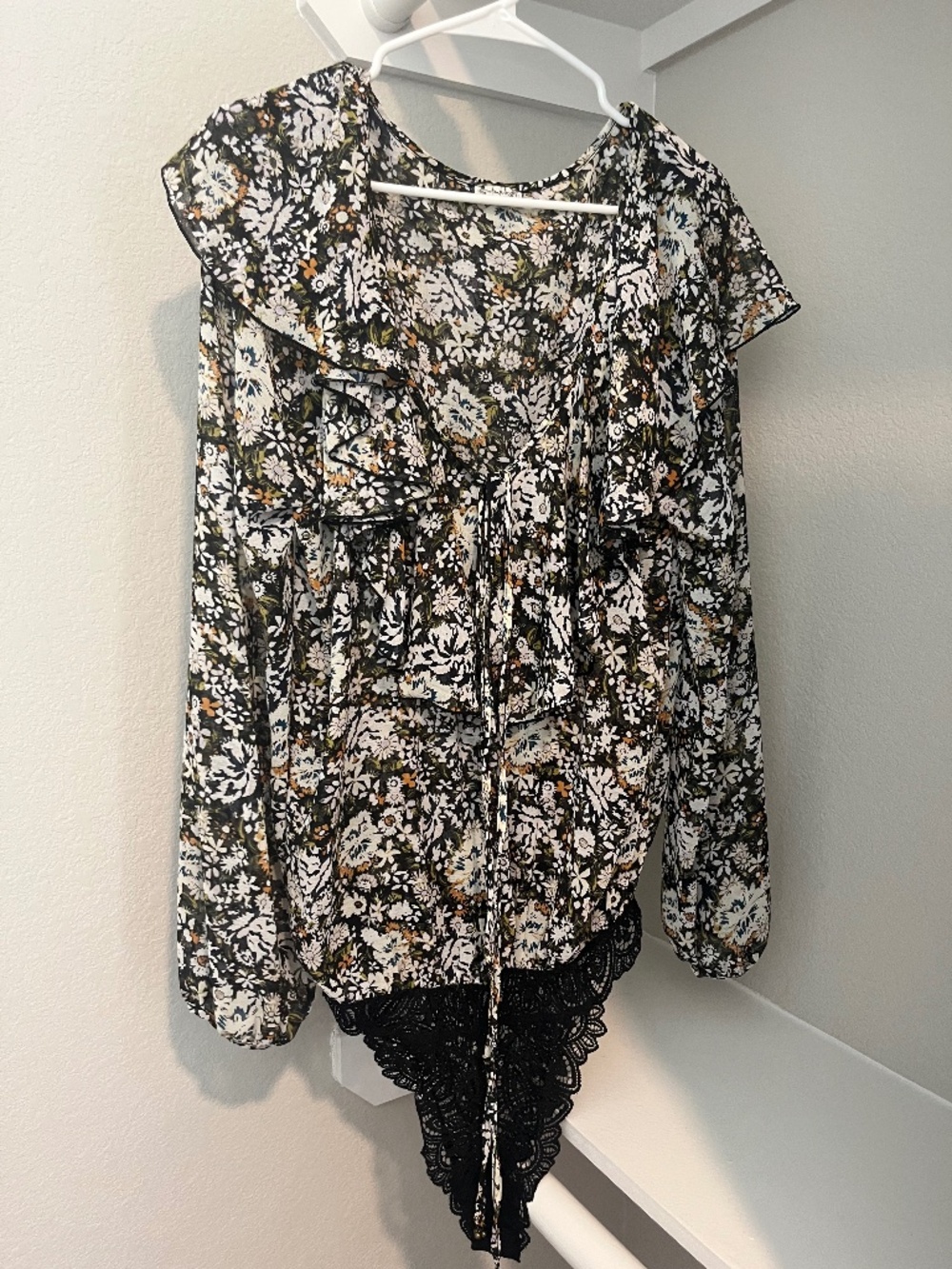 Adorable off the shoulder see through bodysuit with lace details.